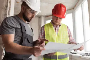 Medium shot men looking at project
