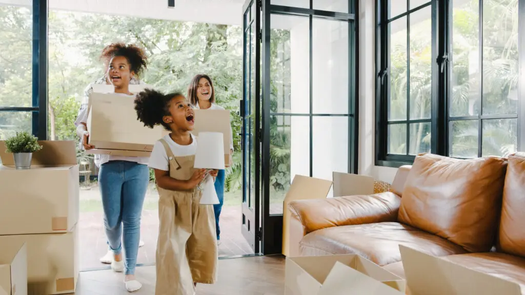 Happy african american young family bought new house.