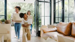 Happy african american young family bought new house.