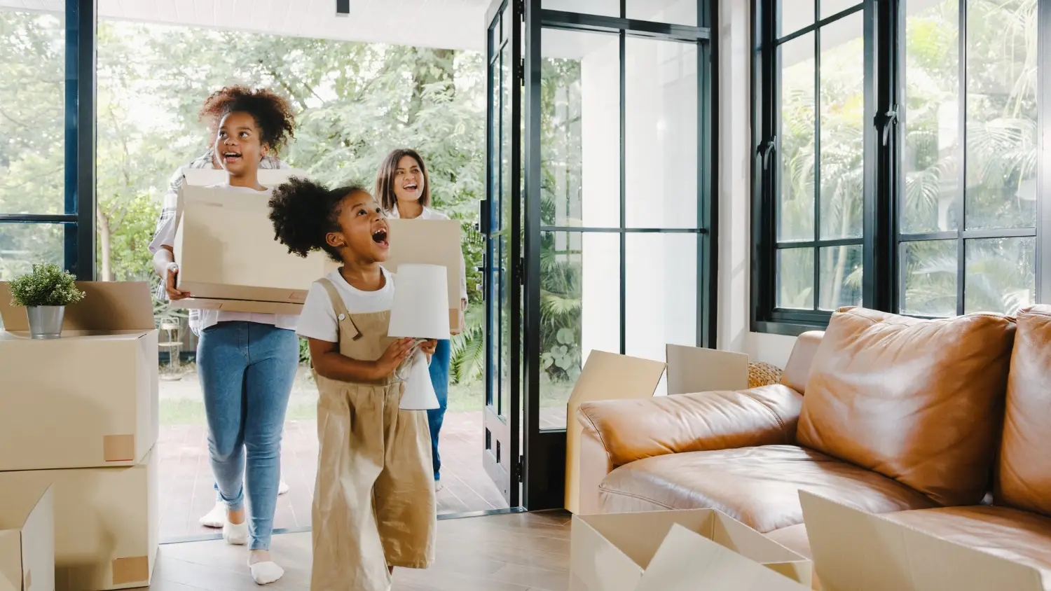 Happy african american young family bought new house.